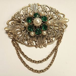 Vintage brooch with green stones